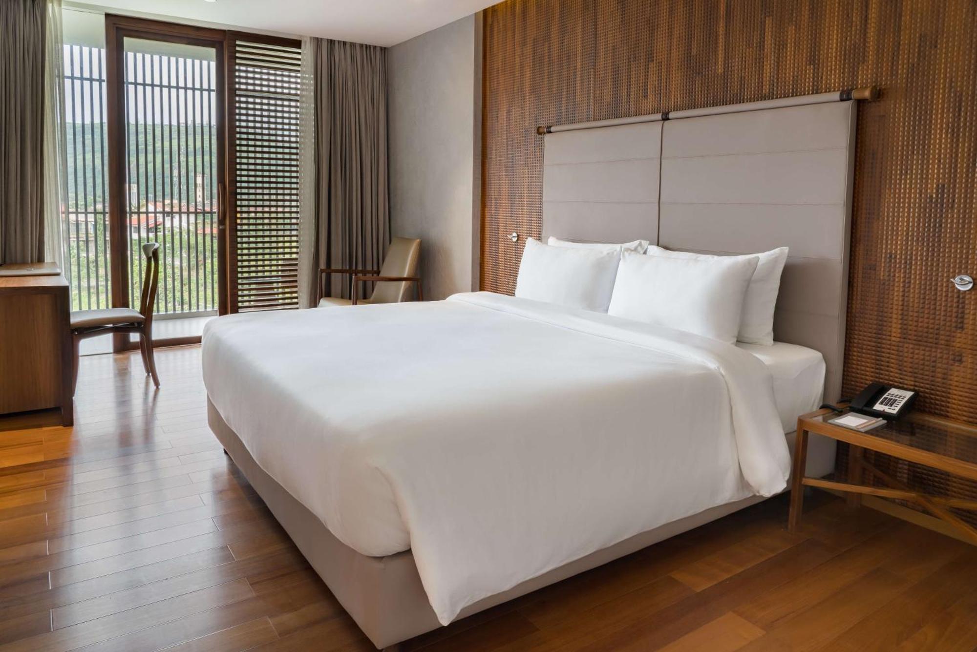 One-Bedroom Suite with 1+1 happy hours in Malhari from 12pm to 8pm and Complimentary in-stay Hotel Credit worth INR 500 redeemable on Spa per stay