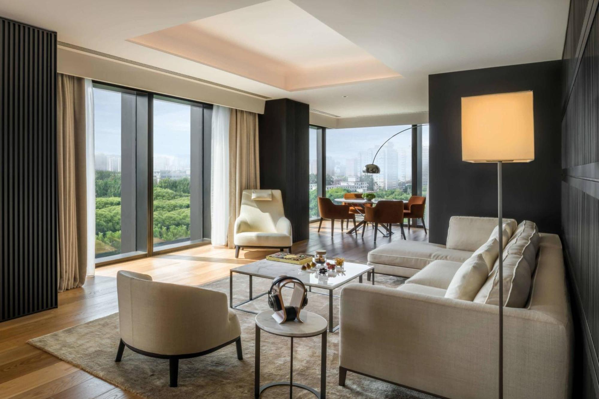 One-Bedroom Deluxe Suite with Liangma River View (Free Minibar soft drinks & beers + Two-way limousine services are available between the hotel and airport or train station in Beijing + unlimited laundry service)