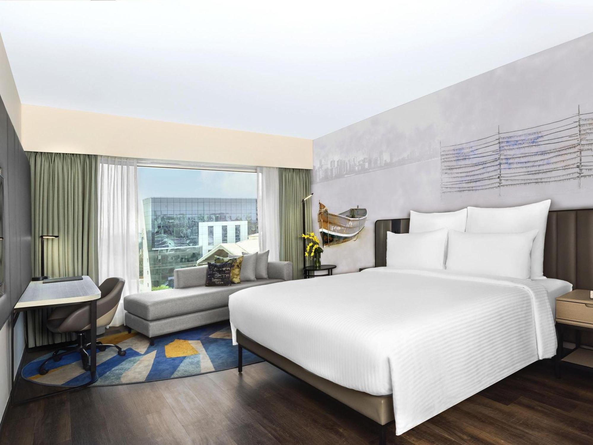 Deluxe King Room with 1+1 Happy Hours from 5pm to 7 pm on select beverages ,  20% Discount on Spa on select packages, Laundry, and Food & Soft Beverages