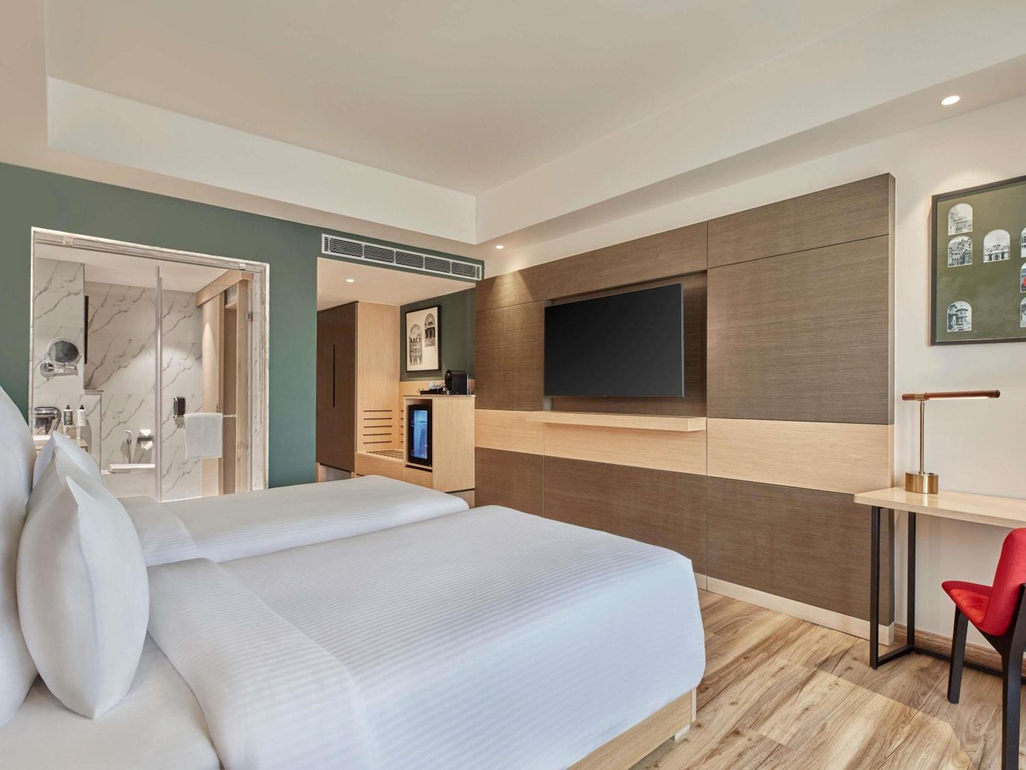 Superior Twin Room - City Side/Non-Smoking: : Avail 15% Off on SPA, 15% off on Food and Soft Beverages, Buy 1 Get 1 on drinks (11 AM-7 PM) at GB*, Free Gaming Zone access, Complimentary Wellness Access (Steam, Sauna, Gym), Kids stay Complimentary