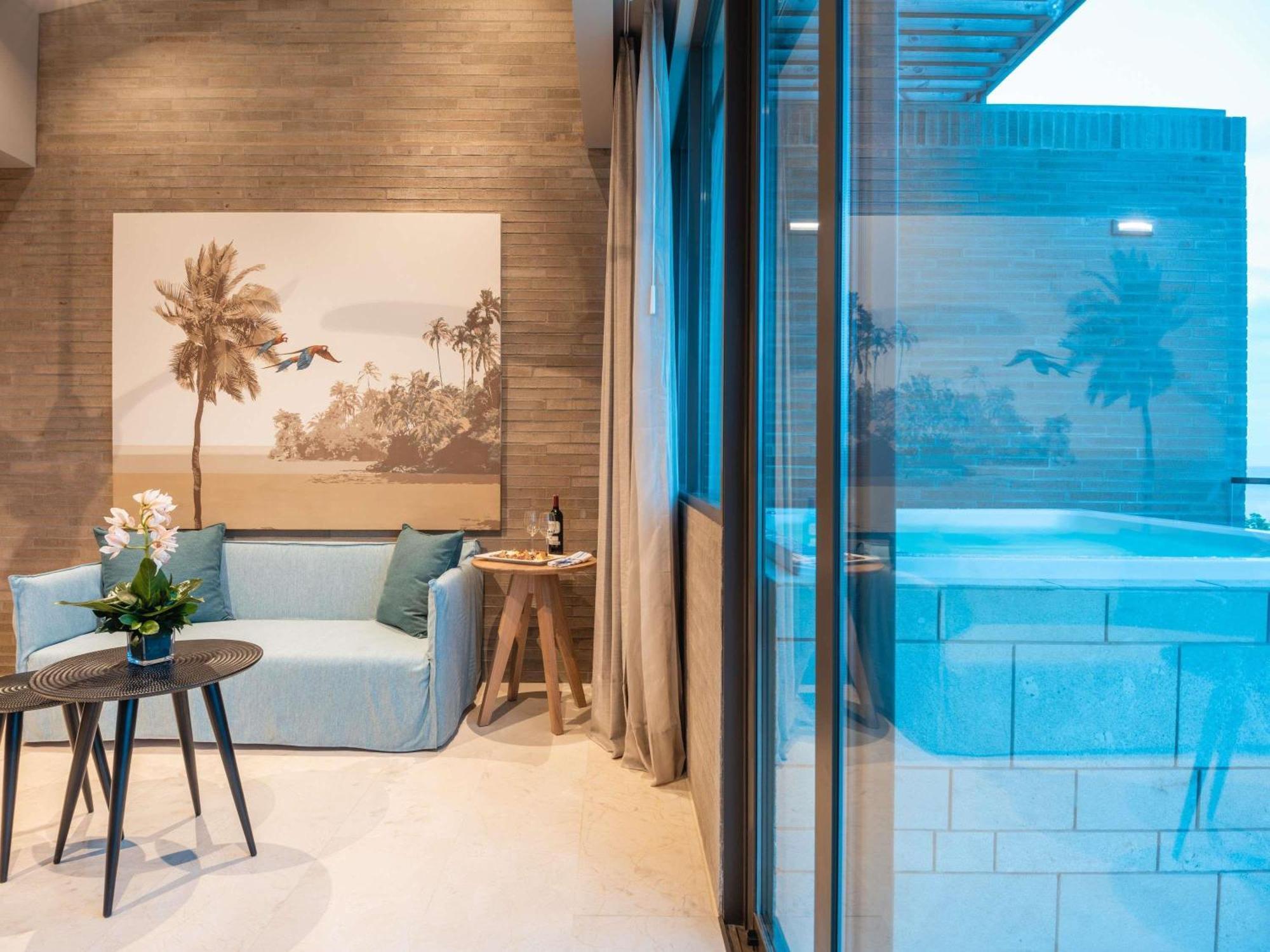 Two-Bedroom Caribbean Family Penthouse with One King Bed, Two Twin Beds and Ocean View