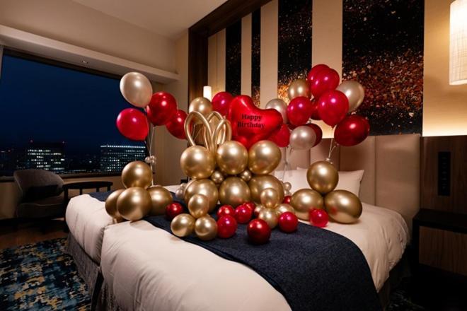 Celebration Suite with Elegant Red & Gold Balloon Decoration