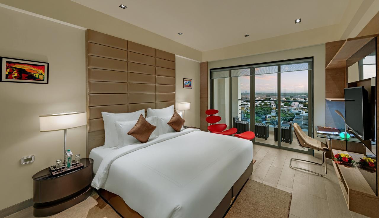 Executive Suite with One King Bed - Living Room and Balcony - City or Garden View - Non-Smoking - 15% Discount on Food & Beverages