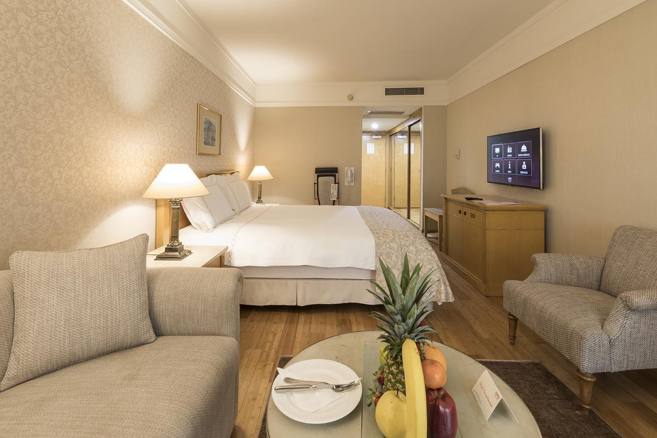 Deluxe Kamer met 1 Queensize Bed en Slaapbank