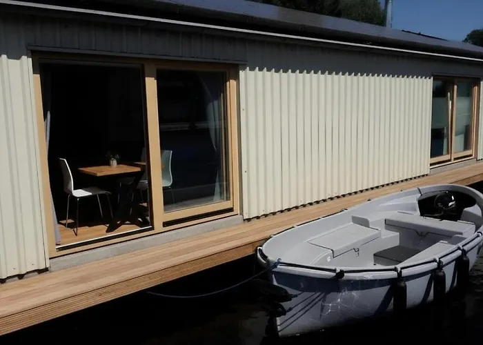 B&Boathouse Amsterdam With Bikes And Motorboat
